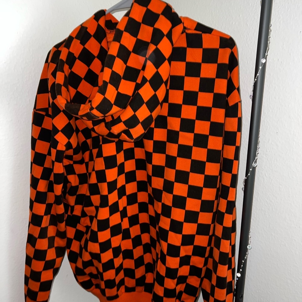 Orangish- red, checkered hoodie. Size Large. Unisex.